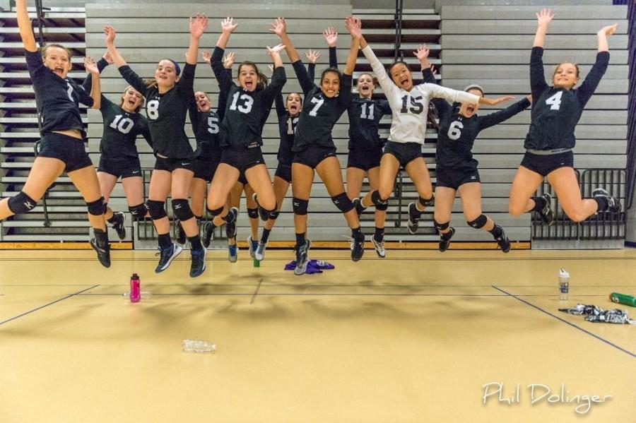 Volleyball team has some fun with their pictures not worrying about always being serious.