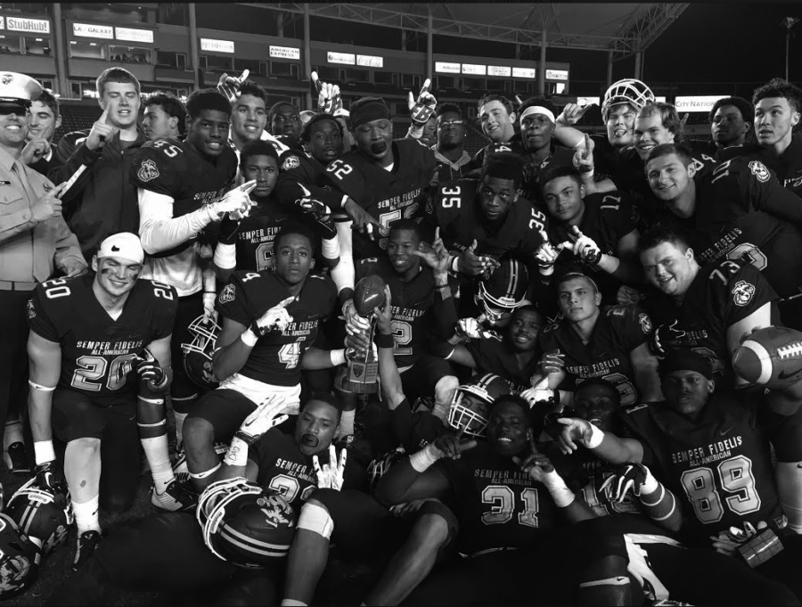 Sparks and his teammates celebrating after winning the Semper Fi Bowl.