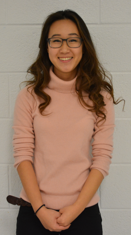 Senior Michelle Kim sports a fashionable pink turtleneck, one of the trends of this winter season.