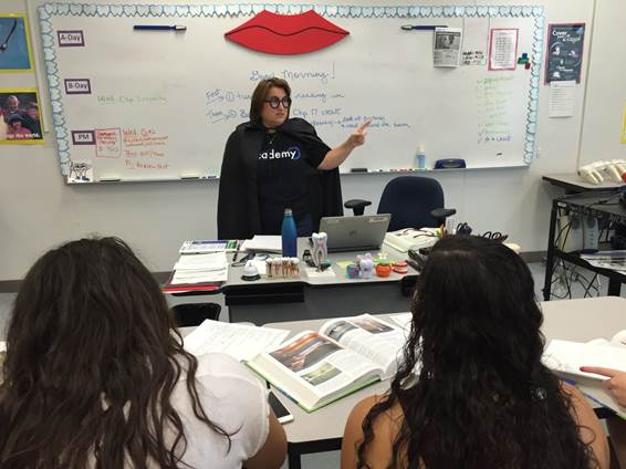 Jennifer Howe teaches her Dental Careers class, all while dressed up as a professor during Homecoming week