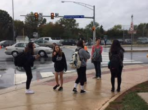 Students impatiently wait to cross Stringfellow Road to get to their cars after school.