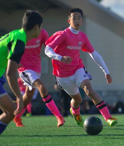 Senior David Yoon runs up the field while playing soccer for his Herndon based travel team.