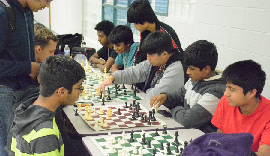 Chess+club+members+play+games+against+each+other+after+school+to+sharpen+their+skills.