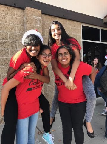 Senior Meghana Mundunuri, pictured on the bottom right with friends in front of her old school, recently moved from California.