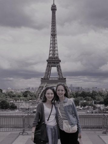 Senior Becca Pierce and former Chantilly junior Hannah Snarr pose in front of the Eiffel Tower.