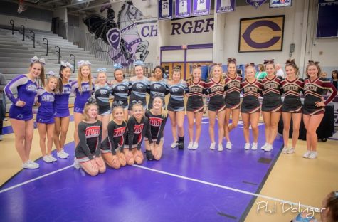 Chantilly varsity cheerleaders pose with their competitors following their legendary Districts win.
