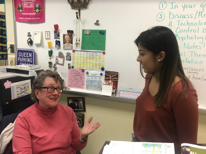 Mary Kay Downes speaks with senior and editor-in-chief Nia Hoq. Downes has inspired countless students and fellow journalism teachers.