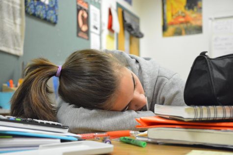 This photo depicts a student sleeping in school in order to highlight the everyday reality for many students who spend countless hours each night doing homework, leaving little time for much needed sleep. 