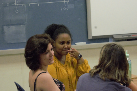 Seniors Lily Black, Jordan Hundley, and Bezawit Abraha engage in a warm-up discussion in Political Science.