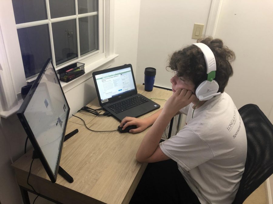 Freshman John Chernisky works from home at his designated learning space in order to focus during class.