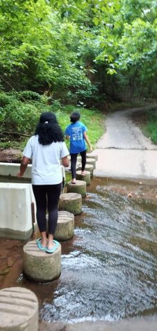 Junior Sheona Jerin explores a trail with her sister on Aug. 20 near a friend’s house. Quarantine has opened up space for many to spend time in nature and with family.