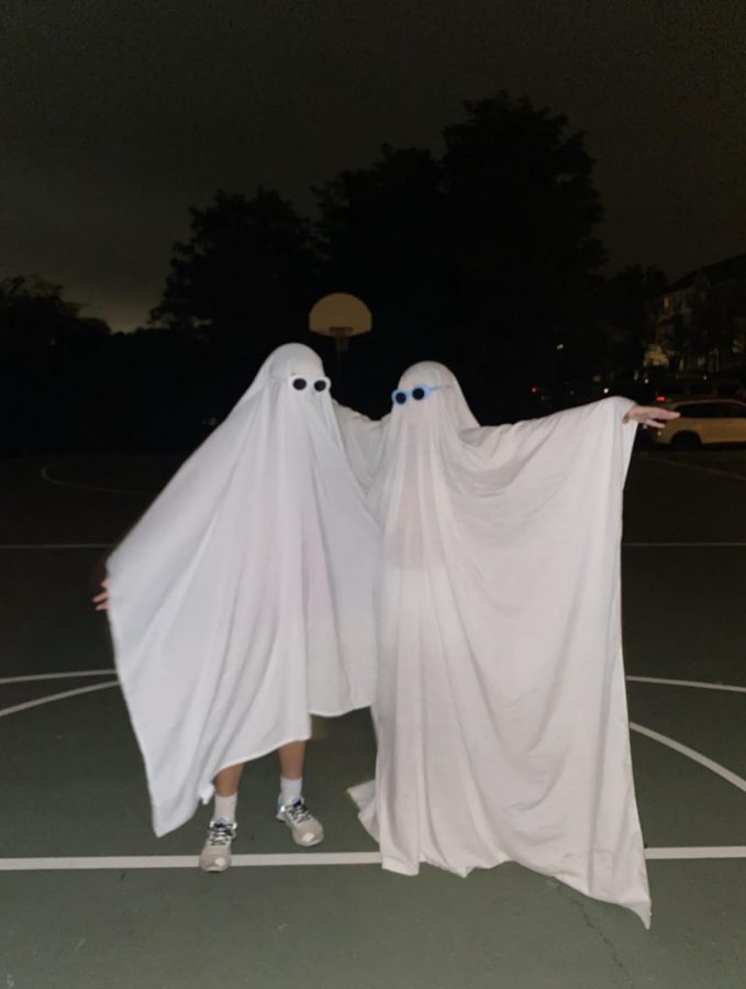 Freshman Linda Gu dresses up as a ghost with a friend on Sept. 27.