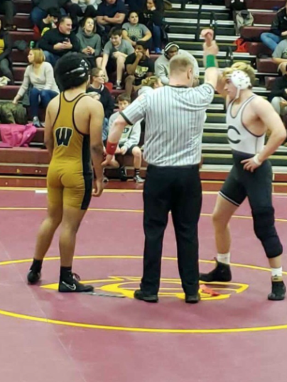 Nolan Riley, a member of the wrestling team wins a match in 2019 against a Westfield wrestling member.