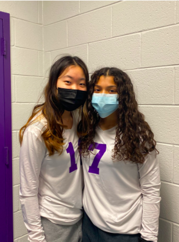 Isabell Lee and Emily Cortez stand together after their first win.