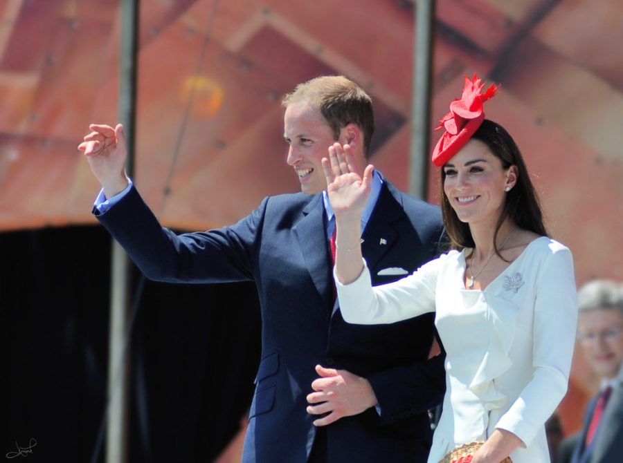 Prince William and Duchess Kate wave to a crowd in Canada.