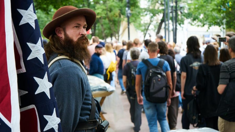 Man+holding+a+confederate+flag+at+a+protest+in+Moscow+on+June+12.