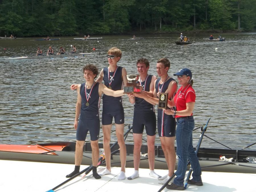 The Albemarle High School Scholastic Rowing Champions pose by the river.