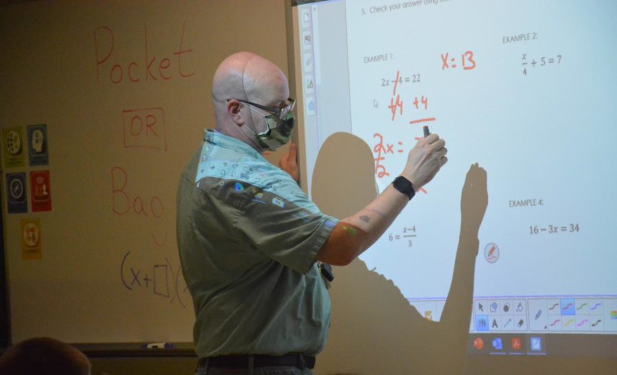 Math teacher Josh Regan teaches students Algebra 1 during period 6 on Sept. 23.
