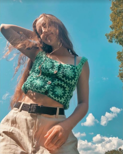 Senior Katelyn Gallaher dressed in her crochet green tank top sweater on June. 6. 