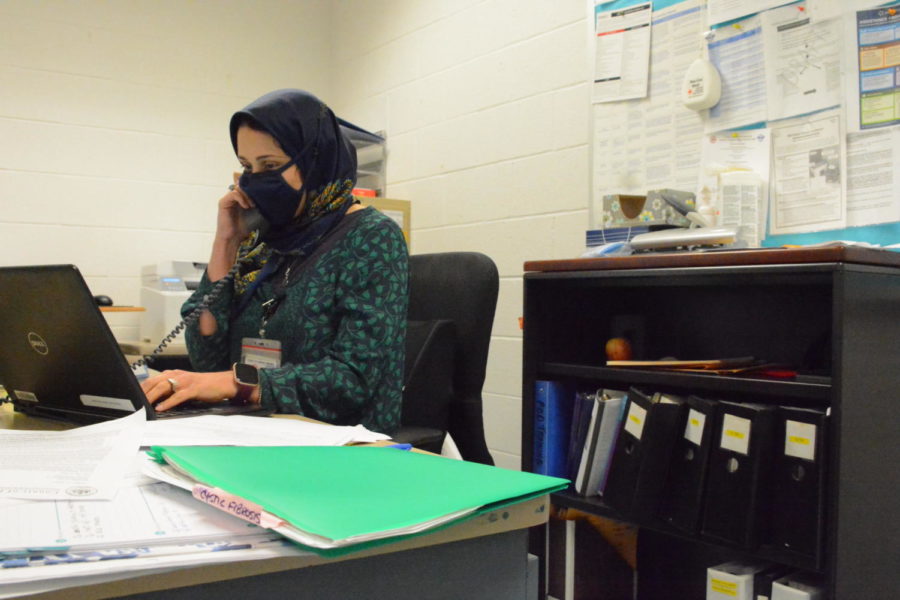 Nurse Aminian Ramissa catches up on some emails in the clinic on Sept. 22.