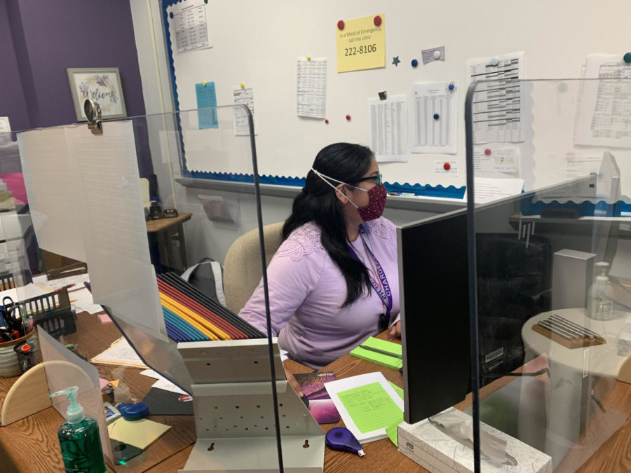 Instructional/office assistant Elizabeth Escobar works on filing and scheduling in the special education department.