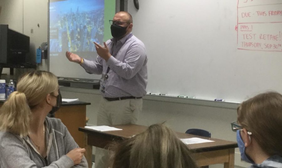 During his sixth period physics class, Tanner DeCrapio explains when the class can do a retake for the quiz they recently finished.