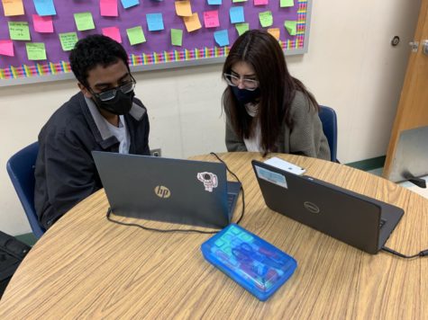 Chantilly Writing Center tutor and senior Natalia Miranda helps senior Anoop Peterson edit his essay for Advanced Placement English Literature and Composition class on Nov. 22. 