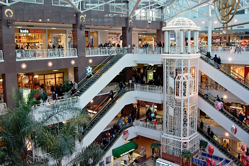 Consumers shop at Pentagon City Mall ahead of Valentine’s Day. While excessive spending creates negative impact, these purchases fuel the retail industry. Photo by Benjamin Schumin under CC BY 2.0.
