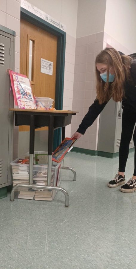 Freshman Ava Boucher is donating a book to the book drive NHS is organizing. 