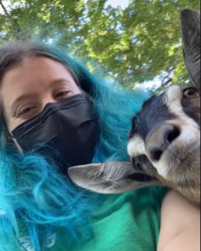 Jocelyn Kammer takes a selfie with her favorite goat, Amera.