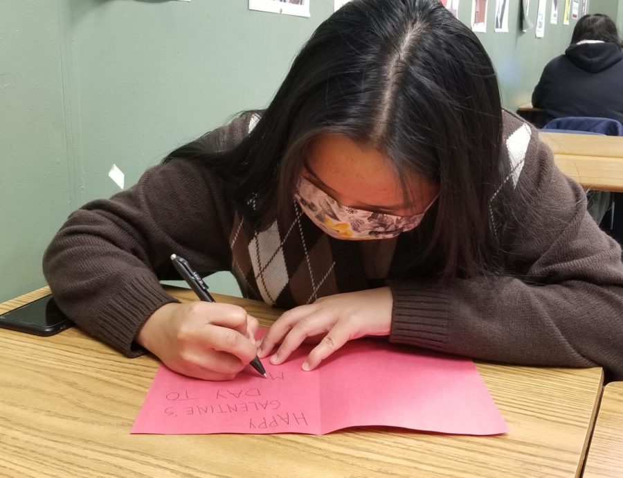On January 14, senior Nicole Rapano works on a Galentines Day card for her friend during Charger Time.