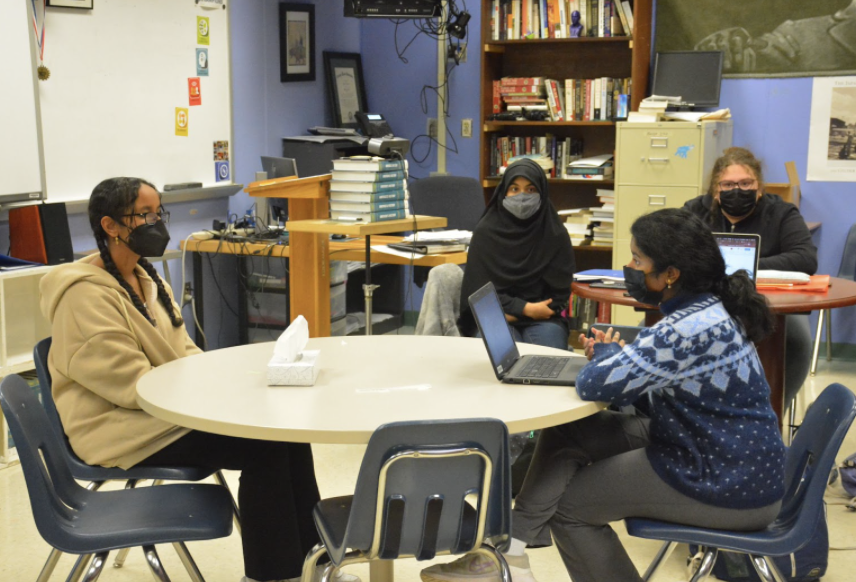 Senior Model Judiciary club member Shruthi Ganapuram prepares for the mock trial by practicing her direct examination questioning with senior Iman Mohamed while seniors Michelle Iglesias and Afreen Refai spectate on Jan. 31. 