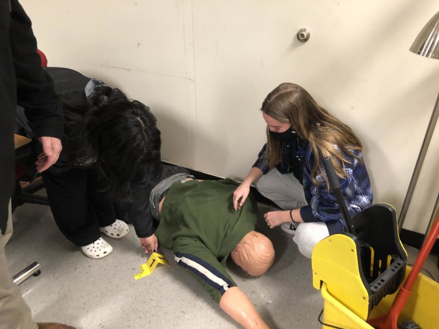 A student tags evidence at a mock crime scene during criminal justice class on Jan 14.