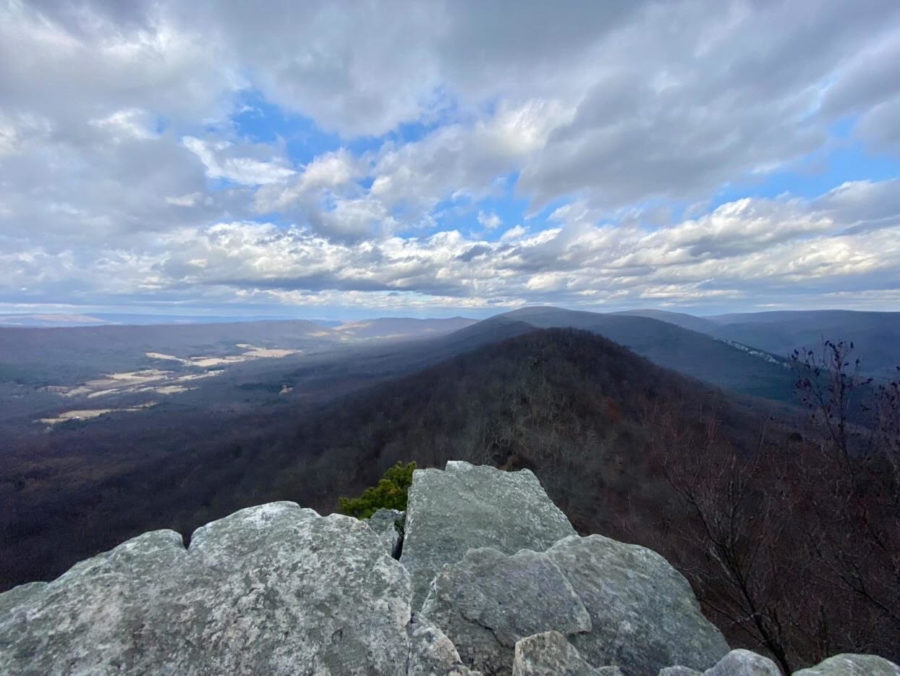 The Blue Ridge Mountains are visible from an overlook on the Great North Mountain on the Big Schloss Trail in the George Washington National Forest, whose 1.8 million acres span Virginia and West Virginia. Hiking shoes are recommended on this trail, as the elevation and fair amount of rock scrambling make it moderate difficulty. Photo used with permission of Connie Wang. 