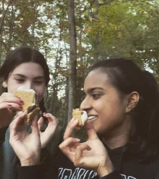 In 2022, seniors Lily Campbell and Ritika Venketesh make s’mores to celebrate Camp Day. 
