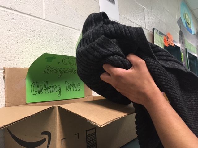 Students donate gently used clothes at the clothing drive set up by the Students for Environmental Activism  room 142.