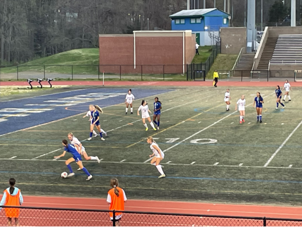 The girls varsity soccer team (in white) played against South Lakes High School (in blue) on April 12, resulting in a loss, 1-0. 
