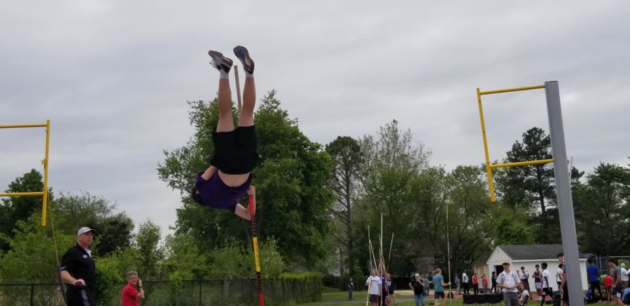 Sophomore+Cole+Landgdorf+performs+a+pole+vault+before+the+track+and+field+meet+on+May+11