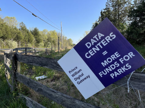 A sign in rural Prince William County promotes the construction of the Prince William Digital Gateway Project.