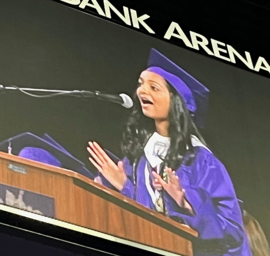 Senior speaker Nayana Celine Xavier compares high school graduation to the end of a season in a sitcom in her graduation speech on June 1 at Eagle Bank Arena. Approximately 80% of the 733 graduates will attend college. Celine Xavier will attend the University of Virginia. 