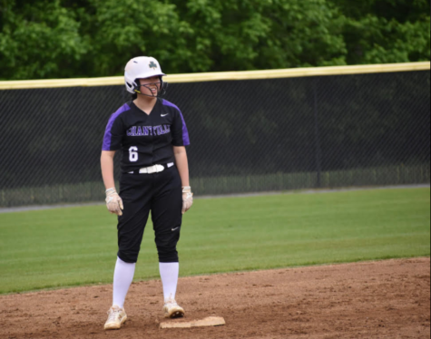 Senior and Editor-in-Chief Katelyn Chu stands up safe after hitting a double against Westfields. 
