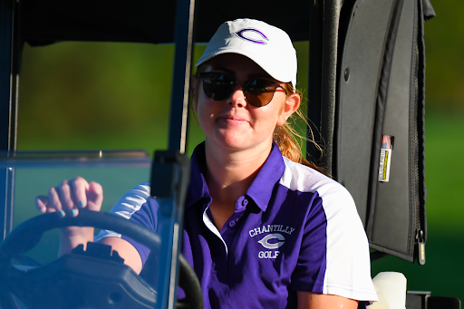 Coach Donnelly drives a golf cart on Sept. 15 at the practice course. 