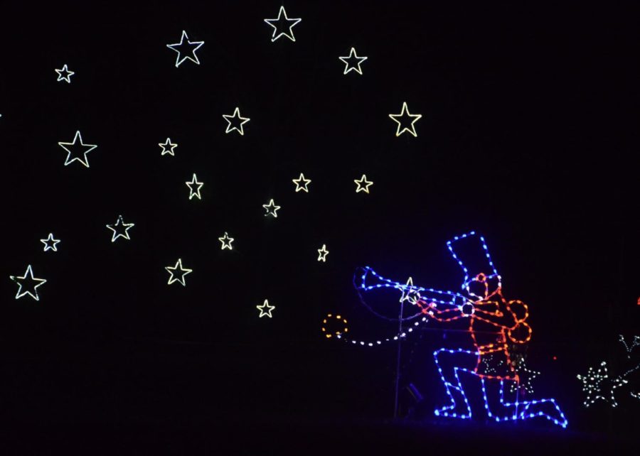 Stars light up the dark night as a toy soldier in the Toy Land section blows them out of his trumpet. Viewers can count the number of toy soldiers scattered throughout the section and submit their answer to the Holiday Village at the end of the illuminated driveway for a prize.