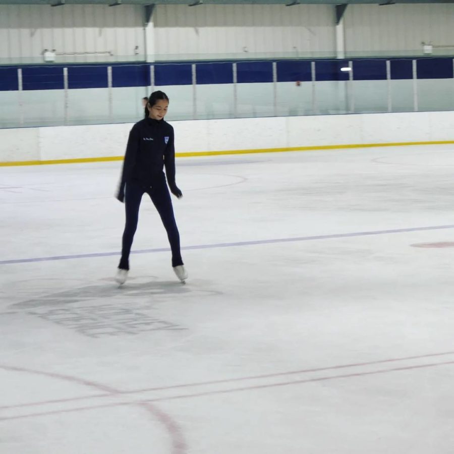 Freshman Hee Theng Chong warms up by skating laps around the rink for her skating lesson at SkateQuest on Nov. 3.  