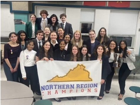 The Speech and Forensics Team and sponsor celebrate after placing first in their regional tournament on Jan. 16, at Madison High School.  20 of the team members qualified for the super regionals tournament. 