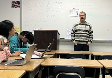 Mr. Prowell advising his students during a weekly club meeting.