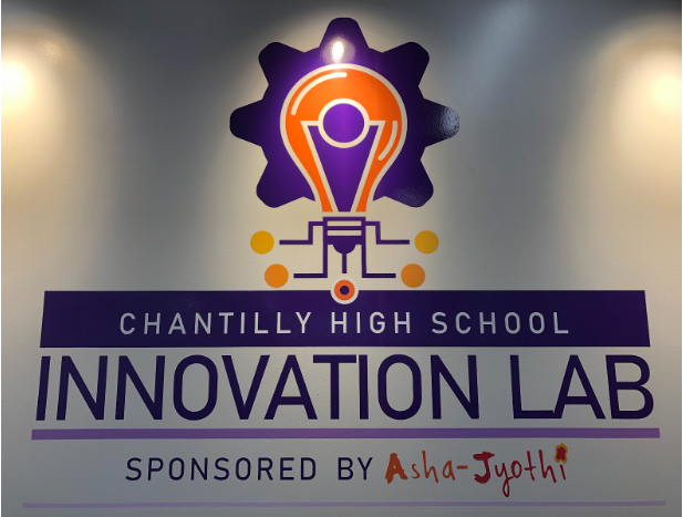 The innovation lab’s logo lit up by an overhead spotlight. Located in the library, the innovation lab is a resource open to all students on every Monday, Wednesday and Friday during CT, lunch and before and after school.