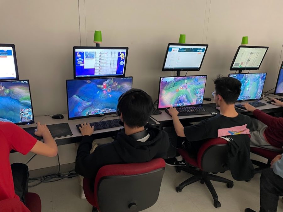 Juniors Felix Do and Richard Xiong play League of Legends during the first esports competition on Feb. 14 in room 584. The first team played against Mclean and won, while the second team ended in a draw with Washington and Liberty. 