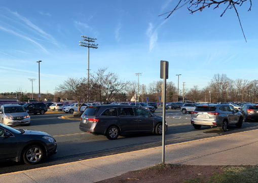 On Feb. 14, at 8 a.m, a backed up line of cars forms, students waiting to be dropped off even as the opening bell approaches.
