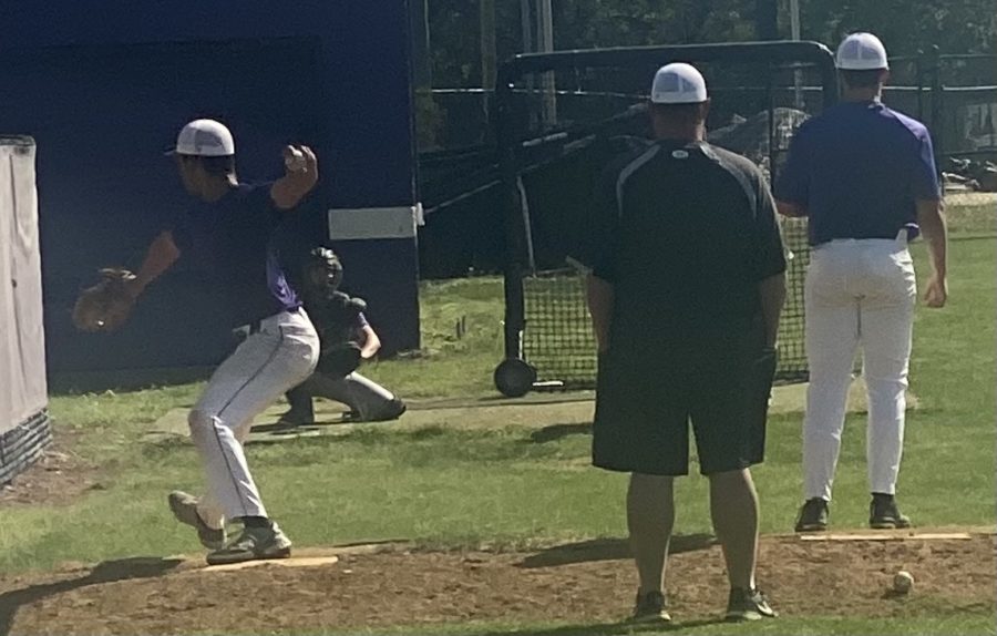 Varsity baseball coach Kevin Ford oversees senior pitcher Isaiah Bumgardner as he practices his hand-eye coordination while sharpening his catching abilities. This is a common way for players to warm up before a game or practice their throwing and catching skills. 

(Photo by Gayda Makki) 

